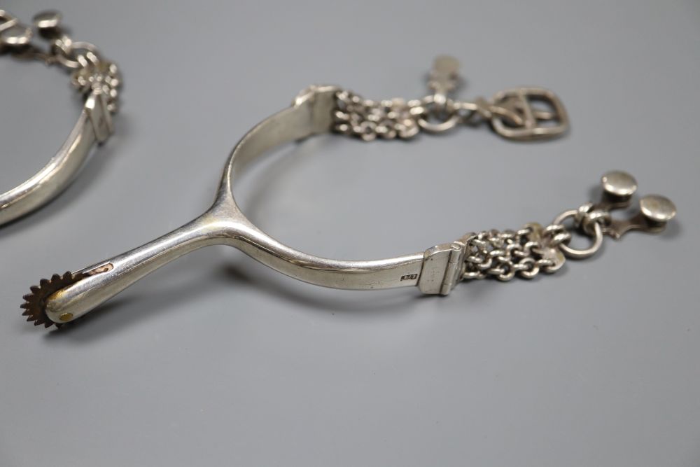 A pair of 19th century Portuguese white metal horse riding spurs, Lisbon mark, makers mark, IFF, diameter 7cm, gross 5.5oz.